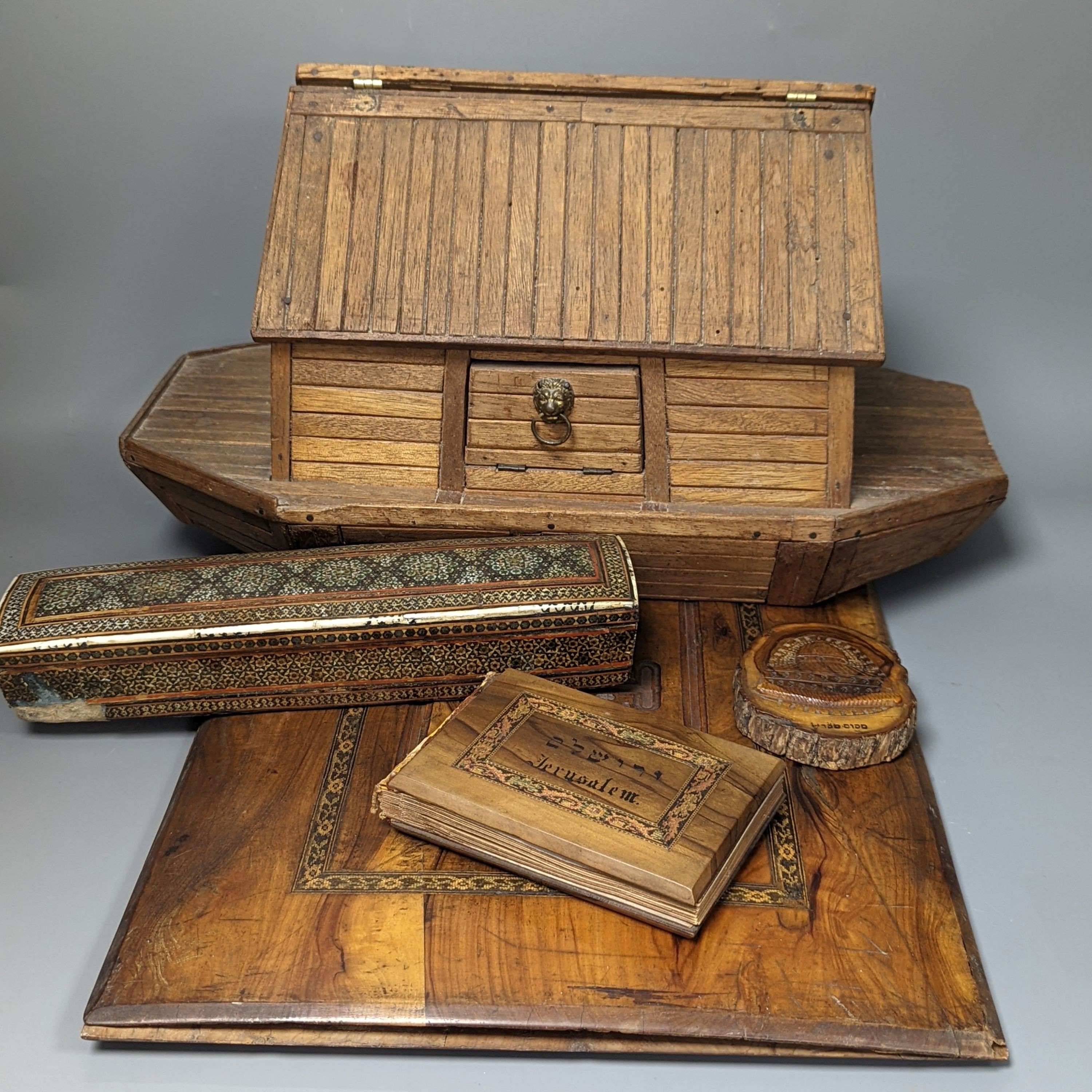 A mixed collection of treen comprising Noah's Ark with animals, olive wood blotter, book ‘Wild Flowers From the Holy Land’ and plaque together with a Syrian box (5)